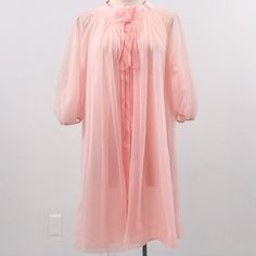 Elegant Vtg Airy Short Nightgown Robe. Soft Flowing Pink Fabric & Multiple Layers, Gathered 3/4 Long Sleeves. Bow & Snap Closure At Top. Vintage Fair Condition - Small Picks & 2 Small Holes That Get Lost In The Layers P6-9. Beautiful & Unique. Cotton Candy Halloween Costume? As-Is 1 Only. Tagless. Model 4. Fits Os. Buy M! Flat~ 17 Sl 35 L Relax Everyday Quarantine Leisure Romantic Sexy Lingerie Intimates Girly Luxury Gathered Ruffle Soft Vintage Hostess 60s Airy Sheer Peignoir Angelic Vintage Pink Nightgown For Spring, Vintage Pink Sleepwear, Retro Pink Sleepwear For Spring, Vintage Pink Sleep Dresses, Pink Vintage Sleep Dress, Vintage Sheer Pink Nightgown, Vintage Pink Sheer Nightgown, Pink Sheer Vintage Nightgown, Vintage Sheer Sleepwear