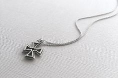 A beautiful Maltese Cross pendant in 925 sterling silver. This hand crafted cross is double sided and hangs from a beautiful, dainty chain. The entire necklace is made of 925 sterling silver with an antique finish to bring out the detailing and shine. This necklace is Nickel-Free and hypoallergenic. Material: 925 Sterling Silver Pendant Size: about 1 inch Chain Length: 16 inches *All purchases will arrive in a gift box! *Available in silver and in bronze *All orders are shipped via USPS First Cl Classic Sterling Silver Engraved Cross Necklace, Classic Engraved Sterling Silver Cross Necklace, Gift Sterling Silver Cross Necklace With Oxidized Finish, Sterling Silver Necklace With Cross Pendant Stamped 925, Classic Sterling Silver Pendant Cross Necklace, Sterling Silver Necklace With Oxidized Cross Pendant, Oxidized Sterling Silver Cross Pendant Necklace, Classic Silver Sterling Silver Cross Necklace, Sterling Silver Cross Necklace Hallmarked