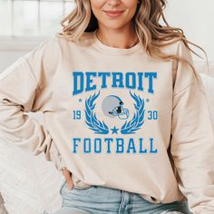 Order by DECMBER 6TH to ensure Christmas delivery. Delivery dates are not guaranteed.  To ensure adequate time for production and shipping, orders must be placed NO LATER THAN DECEMBER 6TH. Show your pride with our Detroit vintage-style football sweatshirt.  Perfect for game day, this Lions Sunday football sweatshirt is a must-have for any fan. It's a stylish Detroit crewneck sweater that makes a great gift for any football enthusiast who supports the Detroit team. .: 50% cotton, 50% polyester . College Football Season Fan Apparel Sweatshirt, Football Season Fan Gear Sweatshirt In Team Colors, Football Season Team Color Sweatshirt, Football Season Fan Apparel Sweatshirt, Team-colored Football Season Fan Sweatshirt, College Football Season Graphic Print Sweatshirt, Team-colored Graphic Print Sweatshirt For Football Season, Football Season Graphic Print Fan Gear Sweatshirt, Football Season Fan Gear Sweatshirt With Graphic Print