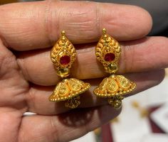 22k Gold Earrings- Real Gold Dangling Jhumka Earrings-Jhumka Earrings- Solid Gold Earrings-Indian Gold Earrings-Rajasthani Gold Stud Jhumkas  This is beautifully handcrafted Indian karigari designed 22k Solid Gold Jhumkas which is designed purely considering the vintage heritage Look design with modern look that gives it eye catchy look ! PRODUCT SPECIFICATIONS:  Material : 22k Solid Gold Weight: 10 gram  approx  Customer satisfaction is our utmost priority, feel free to have any query, would love to assist you!  Jai Shree Shyam🙏🙏 Happy Shopping 🛍️ Bollywood Style Yellow Gold Jhumkas With Latkans, 22k Gold Jhumkas For Ceremonial Navratri, Heavy Gold Jhumkas For Navratri, Yellow Gold Kundan Jhumkas With Latkans, Gold Temple Jewelry Jhumkas For Puja, Traditional Gold Jhumkas For Navratri, Heavy Gold Temple Jewelry Jhumkas, Round Temple Jewelry Jhumkas For Ceremonial Occasions, Temple Jewelry Jhumkas With Latkans For Festivals