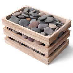 three wooden boxes filled with rocks on top of each other