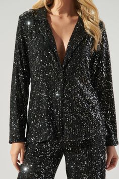 Hit the dancefloor and be the talk of the town in this electrifying jacket. This neo disco look is everything and more. Sequins make this blazer style jacket, highlighting a notched lapel and single button with a slightly tailored fit. Its the perfect piece to elevate any outfit. Wear it on its own, or style it with the matching pants.- Sequins- Tailored- Single button- Lapel- Comes in 2 colorsSize + Fit - Model is 5'10" and wearing size XS- Measurements taken from size S - Chest: 19"- Length: 2 Disco Look, Friday Nights, Blazer Style, Talk Of The Town, Floral Jacket, Tailored Blazer, Matching Pants, Cropped Blazer, The Talk