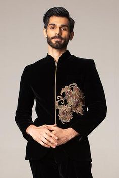 Black bandhgala with placement graded floral motif zari-crystal work. Comes with pleated pants.
Component: 2
Embroidered
Neckline: Mandarin Collar
Sleeve Length: Full
Fabric: Velvet
Color: Black

Closure: Bandhgala: Front zip
 - Aza Fashions Luxury Men's Naqshi Bandhgala, Luxury Jamawar Bandhgala For Men, Luxury Bandhgala For Eid Designer Wear, Luxury Black Bandhgala For Office, Luxury Red Bandhgala For Winter, Luxury Men's Bandhgala With Mandarin Collar, Luxury Men's Party Wear Bandhgala, Designer Luxury Bandhgala For Ceremonies, Luxury Tailored Bandhgala With Mandarin Collar