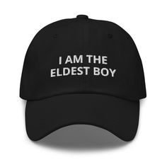 a black hat with the words i am the oldest boy written on it in white