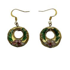 Vintage 70's dangle earrings have gold tone donut circles with cloisonne pink flowers and green leaves. It has the same design on both sides. Lightweight earrings measure 7/8 in diameter with gold tone ear wires. Good condition. Please see photos for more details.   All items are vintage that are preowned. All of the items may show some form of wear due to their age. Please kindly remember that these items are anywhere from 30-80 years old. I make every attempt to clearly describe the item, incl 70s Jewelry, Round Dangle Earrings, Lightweight Earrings, 80 Years, Etsy Earrings Dangle, Light Weight Earrings, Ear Wires, Vintage 70s, Green Leaves