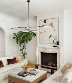 a living room filled with furniture and a fire place in front of a painting on the wall