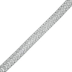 Your evening looks aren't complete without this exquisite diamond bracelet. Crafted in cool 10K white gold, this style showcases 1/20 ct. diamonds sparkling along the open-worked center. Diamond-lined borders complete this dazzling design. Stunning with 6 cts. t.w. of diamonds and a bright polished shine, this 7.0-inch bracelet secures with a tongue and groove clasp. Sterling Silver Bracelet With Pave Diamond Setting, Brilliant Cut Diamond Bracelet In White Gold, Platinum Diamond Bracelet With Pave Setting In White Gold, Platinum Diamond Cut Bracelet In Diamond White, Diamond Bracelet With Pave Setting, Silver Brilliant Cut Diamond Bracelet In Platinum, Silver Platinum Diamond Bracelet With Brilliant Cut, White Gold Diamond Bracelet With Pave Setting, Platinum Diamond Bracelet With Accents