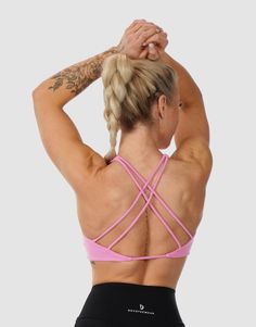 This Twisted Sports Bra combines style and performance. Crafted to make you feel secure and look stunning. It's like a second skin that never rides up, giving you the freedom to move. The stretchy fabric gives you freedom to move, while the moisture-wicking feature ensures you stay fresh. Feel confident and supported with the intricate strap design. Whether you're lifting weights or stretching, this top is your go-to for any activity. Grab yours and feel the difference! Model: Samantha wears bra Light Sports Activewear With Built-in Padding And 4-way Stretch, Nylon Cross Back Activewear For Sports, 4-way Stretch Strappy Yoga Activewear, Strappy Yoga Activewear With 4-way Stretch, Strappy 4-way Stretch Activewear For Sports, Breathable Strappy Athleisure Activewear, Moisture-wicking Stretch Sports Bra With Strappy Design, 4-way Stretch Activewear With Built-in Padding For Training, Yoga Activewear With 4-way Stretch And Strappy Design