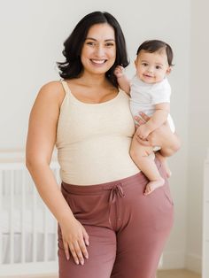 A buttery-soft bamboo cami for around-the-clock comfort. Crafted from stretchy, breathable fabric, this nursing & pumping camisole features a flattering scooped neckline and a built-in shelf bra for extra support. The patented double-layer system gives you the feeding flexibility you love; for hands-free pumping, simply unclip the outer layer, and slide your flanges through the openings in the inner layer, and for nursing, unclip both layers. Perfect for pregnancy or postpartum, pumping or nursi Nursing Camisole, Mom Checklist, Pumping Bra, Nursing Tank Top, Hands Free Pumping, Delivery Gown, Pumping Bras, Post Partum Outfits, Nursing Tank