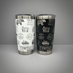 two stainless steel tumblers with black and white designs, one is the same size as the other