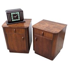 two pieces of furniture with a clock on top and one piece of wood below it