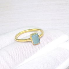 This handcrafted jewelry is made by Crystal Legacy . For each piece , we handpick the best gemstone and ensure high quality craftsmanship and intrinsic designing. Buy it for yourself of for your loved ones. Chalcedony Ring, Chalcedony Rings, Chalcedony Jewelry, Tiny Ring, Boho Ring, Promise Ring, 18k Gold Plated Brass Ring, Gold Ring, For Her, Gemstone -Chalcedony Weight - 3gm Stone Size -4x8mm Metal: Brass With 18k Gold Plated Each piece is ready in stock at our store in Vancouver, Canada. Exac Yellow Gold Chalcedony Jewelry Gift, Yellow Gold Chalcedony Ring Gift, Handmade Gold Chalcedony Rings, Chalcedony Rings Fine Jewelry For Gift, Handmade Yellow Gold Topaz Ring Gift, Fine Jewelry Chalcedony Gemstone Rings, Handmade 14k Gold Crystal Ring As Gift, Handmade Yellow Gold Rectangular Rings, Handmade Gold Topaz Ring For Gift