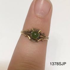 Smaller gold colored ring with small round jade colored stone. Vintage ring inventory form my great grandmother's restaurant and gift shop in Silverton, CO that she owned and operated from the 1960s to 1996. Style 1378SJP Sizes available: Size 4 - qty 2 Size 4.5 - qty 4 Size 5 - qty 2 Vintage Yellow Gold Round Birthstone Ring, Vintage 14k Gold Round Birthstone Ring, Vintage Yellow Gold Birthstone Ring, Vintage Hallmarked Rings With Round Stone, Vintage Hallmarked Round Opal Ring, Vintage Hallmarked Ring With Round Stone, Vintage Opal Promise Ring, Gold Emerald Ring With Round Stone, Antique 14k Stamped Round Emerald Ring