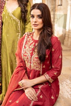 Maroon A-line kurta in linen silk base fabric embroidered in gota work. Paired with banarasi palazzo and tissue dupatta.
Component: 3
Pattern: Embroidered
Type Of Work: Gota Work
Neckline: Round
Sleeve Type: Straight
Fabric: Kurta: Linen Silk; Palazzo: Banarasi Chanderi; Dupatta: Tissue Chanderi; Lining: Mulmul
Color: Maroon
Other Details: 
Contrast gold gota embroidery
Tassel dupatta
Note: The green kurta set worn by the other model is not for sale
Occasion: Wedding - Aza Fashions Unstitched Sets With Gold Embroidery, Red Raw Silk Dress With Gota Work, Embellished Red Raw Silk Sets, Red Dress With Gold Embroidery For Eid, Embellished Raw Silk Traditional Wear In Red, Red Embellished Straight Kurta, Red Embellished Silk Kurta, Red Embellished Kurta, Embellished Raw Silk Red Traditional Wear