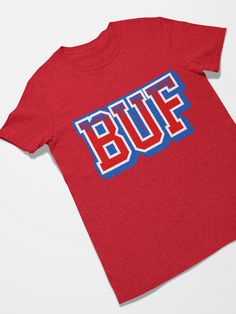 Buffalo Football Retro Sports Letters Tee Shirt Makes a great gift for Father's Day, Mother's Day, Birthdays and for retro 90's parties. Celebrate 90's and 80's retro pop culture in style. The unisex heavy cotton tee is the basic staple of any wardrobe. It is the foundation upon which casual fashion grows. All it needs is a personalized design to elevate things to profitability. The specially spun fibers provide a smooth surface for premium printing vividity and sharpness. No side seams mean there are no itchy interruptions under the arms. The shoulders have tape for improved durability. .: 100% cotton (fiber content may vary for different colors) .: Medium fabric (5.3 oz/yd² (180 g/m .: Classic fit .: Tear-away label .: Runs true to size Pop Culture Letter Print Shirt, Sports Letters, Retro Pop Culture, Football Retro, Buffalo Football, Retro Sports, Retro Sport, Retro Tee, Retro Pop