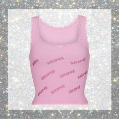 Skims Rhinestone Logo Pointelle Tank In Bubble Gum Size M Nwt! Rare Fits True To Size Classic Tank Style W/ Front Scoop Neckline Delicate Lace Trims Along Neckline & Arm Opening Rosette Accent @ Center Front Neckline Repeating Skims Logo W/ Rhinestone Details 92% Cotton / 8% Spandex “This Classic Feminine Tank Has Delicate Lace Trims Along The Neckline And Arm Opening And Repeating Skims Logo With Rhinestone Details. Features Rosette Accent At Center Front Neckline. Complete The Look With Rhines Skims Rhinestone, Classic Feminine, Long Tank, Lace Trims, Cozy Knits, Knit Tanks, Steel Blue