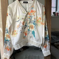 Never Worn!!! Silk Bomber Jacket With Floral Serial Spring Cream Outerwear With Floral Print, Cream Floral Print Outerwear For Spring, White Floral Print Winter Outerwear, White Floral Print Outerwear For Fall, White Casual Outerwear For Spring, White Spring Outerwear For Brunch, White Spring Outerwear For Day Out, Bomber Jackets, Sleeve Detail