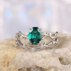 a green ring sitting on top of a rock