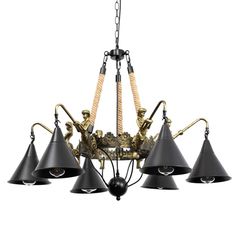 a chandelier with five black shades hanging from it's arms and four brass figurines on each arm