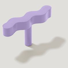 a purple bench sitting on top of a white floor next to a shadowless wall