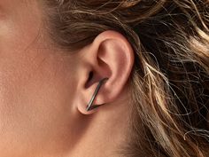 Here you may see a truly modern cuff that will definitely make a statement on your ear with its illusion effect! Big V earring climber that you may also wear as long drop stud. You may wear it all day long as it comfortably stays stable. They are made of of black rhodium on sterling silver base with a satin finish. You just need an earlobe piercing to wear it and you will be able to bend it a little for a tighter fit! PLEASE BE ABSOLUTELY SURE THAT THE SIZE OF THE CUFF FITS YOUR EAR! Every ear i Silver Edgy Ear Cuff For Party, Edgy Silver Ear Cuff For Party, Minimalist Pierced Ear Cuff For Party, Minimalist Metal Ear Cuff For Party, Minimalist Ear Cuff For Party With Ear Wire, Minimalist Pierced Cartilage Earrings For Party, Minimalist Silver Ear Cuff For Party, Minimalist Cartilage Earrings For Party, Edgy Single Ear Cuff As Gift