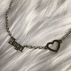 You can select this chain with the heart ( pictured on the angel chain or without like the baby chain). This is a strong yet delicate looking chain. It's completely made of stainless steel so it's much stronger and harder to scuff/tarnish than other metals. The Baby and Angel charms are tiny and cute! They are one inch in length. See size comparison picture. *DISCLAIMER: all my jewelry and handmade objects are NOT intended for children or to be used by them. All present a possible choking hazard Dainty Stainless Steel Heart Necklace With Clavicle Chain, Dainty Stainless Steel Heart Necklace, Silver Heart-shaped Name Necklace, Dainty Hypoallergenic Stainless Steel Charm Necklaces, Alternative Accessories, Angel Charms, Necklace Gothic, Aesthetic Streetwear, Heart Pictures