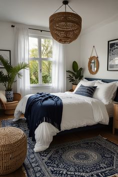 a bedroom with a bed, rugs and pictures on the wall above it is decorated in blue and white