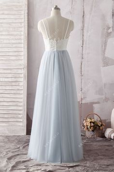 Combined with delicate ivory lace and soft ice blue tulle, this elegant Two Tone Lace Tulle Sweetheart Floor Length Casual Bridal Gown features sweetheart neckline, spaghetti straps and low back. The floor length A-line skirt flows with every step. Wear this beautiful gown on your wedding day for the true romance at heart. shown color two-tone( light ivory/ice blue) bra support with cups boning yes closure back zipper lining fully lined *Color options are only for skirt. The top remains in Light Blue Gown With Tulle Skirt And Fitted Bodice, Debutante Ball Tulle Gown With Lace Back, Blue Lace Bodice Wedding Dress, Blue Lace Bodice Gown For Debutante Ball, Floor-length Tulle Wedding Dress With Illusion Neckline, Light Blue Gown With Sweetheart Neckline For Debutante Ball, Blue Gown With Lace Bodice For Debutante Ball, Sweetheart Neckline Gown With Lace Back For Debutante Ball, Bridesmaid Tulle Gown With Sweep Train