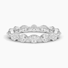 a white gold wedding band with round cut diamonds