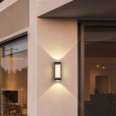 an outdoor wall light mounted on the side of a building