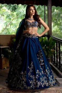 Navy blue lehenga with placement floral motif sequin work and cutwork hem. Comes with embroidered blouse and organza dupatta.
Components:3
Embroidered
Neckline:Sweetheart
Sleeve Length:NA
Fabric:Lehenga and Blouse: Raw Silk; Dupatta: Organza
Color:Blue
Cutwork detail
Tassel tie-up back
Plunging neck
Note: Cancan worn by the model is not for sale - Aza Fashions Lehenga Blue, Royal Blue Lehenga, Navy Blue Lehenga, Lehenga Bridesmaid, Bridesmaid Lehenga, Raw Silk Lehenga, Anushree Reddy, Lehnga Dress, Lehenga Wedding