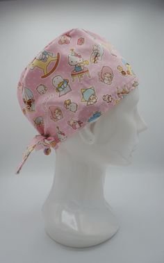 a white mannequin head wearing a pink hello kitty hat