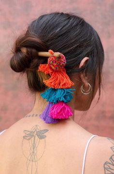 1. 100% artisanal 2. Handmade with love by Aftaab Get creative and dress your hair into cute buns with our handcrafted bun sticks. Color: Multicolour Material: Thread and wool tassels and pom poms Quantity: 1 Wash Care: Spot clean/ Dry clean This product has been crafted by hand and may have slight irregularities or imperfections in color or embellishment. These irregularities are the result of the human involvement in the process and add to the finished products charm while ensuring you have on Bun Stick, Wool Tassels, Cute Buns, Shirt Jacket Men, Drape Saree, Silk Roses, Get Creative, Co Ord Set, Handmade With Love