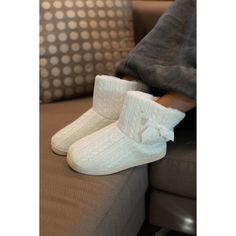 Get ready for winter with The Tessa Cable Knit Plush Bootie! This bootie is just as cuddly as it looks. The exterior is made from a plush material that ensures warmth and comfort. The stylish pattern is completed with a bow design for an added touch of sophistication. This bootie is available in either gray or Winter white, each of which adds a beautiful touch to any outfit. Whether you want to stay cozy or chic, these booties are perfect for any occasion! Cozy Winter Boots With Plush Lining, Cozy Warm Boots For Cold Weather, Warm Cozy Boots For Cold Weather, Cozy Knitted Booties With Round Toe, Warm Winter Booties With Round Toe, Casual Winter Booties With Plush Lining, Cozy Winter Boots For Cold Weather, Indoor Winter Booties With Round Toe, White Boots With Plush Lining For Winter