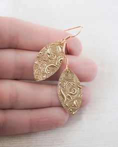 Beautiful, elegant and intriguing earrings made with bronze clay, textured with a playful pattern and then cut into a shape of a leaf. The earrings are a bit longer than 1.5in (40mm). The widest part of the metal is 9/16in (14mm). Bronze earwire. MADE TO ORDER, please allow 3-4 business days before I ship your order. The earrings are made using a unique material - Bronze Metal Clay, which after firing at high temperatures produces bronze objects. After firing I hand-polished them to a high shine Tiny Gold Earrings, Blue Wedding Jewelry, Blush Earrings, Silver Bridal Earrings, Silver Chain Earrings, Book Earrings, Lapis Earrings, Butterfly Wing Earrings, September Birthstone Jewelry