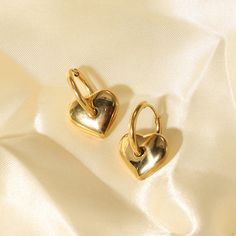 Embrace the sweet elegance of Heart Charm Earrings, beautifully crafted in 18k gold plating. These earrings feature charming heart charms, perfect for adding a touch of love and sophistication to any ensemble. Symbol Of Love, Love Symbols, Charm Earrings, Mild Soap, Heart Charm, Gold Plating, A Symbol, Timeless Beauty, My Jewellery