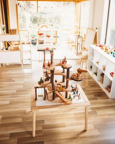 a child's play room with wooden toys on the floor