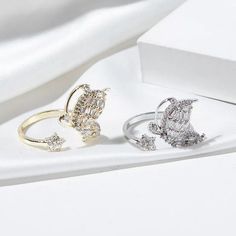 Luxurious And Elegant Our Zircon Butterfly Rings are designed with sophistication in mind. Open design to adjust to any size finger, made with Cubic Zirconia Diamonds to add that sparkle. Gold Opening Rings, CZ Butterfly Rings, Butterfly Ring Bling Crystal Open Ring For Wedding, Sparkling Cubic Zirconia Open Ring, Elegant Open Crystal Ring For Wedding, Diamond Open Promise Ring, Adjustable Dazzling Cubic Zirconia Rings, Adjustable Cubic Zirconia Crystal Ring For Wedding, Dazzling Adjustable Cubic Zirconia Rings, Adjustable Cubic Zirconia Diamond Ring For Party, Elegant Adjustable Crystal Ring With Sparkling Stones