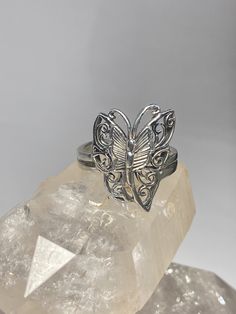 "Butterfly Ring Butterflies Band sterling silver women Size 6.75 Weight 5.4g Length. 7/8\" Width. 1/2\" Thinnest part of band 1/8\" Free Shipping & Free Postal Insurance Delivered in a Gift Box If you do not want the ring polished and want to leave the natural patina please let me know at the time of purchase as I do polish rings before I ship rings out. Thanks Free First Class shipping and postal insurance is included. If you want to upgrade to priority kindly pay an additional fee to do so Silver Butterfly Filigree Jewelry, Silver Filigree Butterfly Jewelry, Vintage Adjustable Sterling Silver Butterfly Ring, Adjustable Vintage Sterling Silver Butterfly Ring, Adjustable Silver Butterfly Ring, Silver Butterfly Jewelry For Wedding, Silver Engraved Butterfly Jewelry, Classic Silver Butterfly Ring For Anniversary, Adjustable 925 Stamped Butterfly Ring