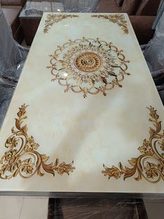 a white table with gold designs on it