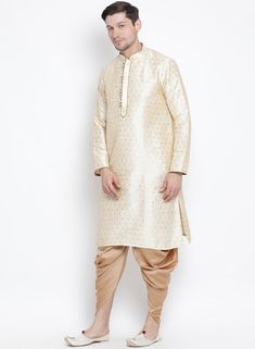 VM By VASTRAMAY Men's Gold Zari Weaved Kurta Dhoti Set Experience the elegance and grandeur of traditional attire with the VM By VASTRAMAY Men's Gold Zari Weaved Kurta Dhoti Set. This exquisite ensemble is designed to make you stand out on any occasion, be it a wedding, festival, or cultural event. The rich gold hue and intricate zari weaving add a touch of luxury and sophistication to your wardrobe. Embrace the timeless charm and grace of ethnic wear with this stunning kurta dhoti set. Key Feat