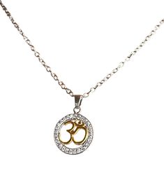 Om Charm Pendant with Chain (925 Silver with Gold Plating) Material: Base: 925 Sterling Silver (durable, hypoallergenic for most people) Accents: 14k yellow gold plating (for a touch of elegance) on specific elements Design: Pendant: 925 Silver Om symbol in a delicate design (cut-out, etched, etc.) Chain: 925 Sterling silver chain with a spring clasp closure Perfect for: Those who follow Hinduism, Buddhism, or appreciate the spiritual meaning of Om Layering with other necklaces for a personalized look A meaningful gift for someone who enjoys yoga or meditation Note: Gold plating adds a touch of luxury but can wear off over time with exposure to chemicals (perfume, lotions) . Proper care (storing in a pouch, avoiding harsh chemicals) can extend the life of the plating. Spiritual White Gold Pendant Charm Necklaces, Spiritual White Gold Pendant Charm Necklace, Silver Symbolic Charm Necklace With Adjustable Chain, Symbolic Silver Charm Necklace With Adjustable Chain, Symbolic Necklaces With Round Silver Pendant, Symbolic Necklace With Silver Chain And Round Pendant, Symbolic Necklaces With Silver Chain And Round Pendant, Symbolic Silver Pendant Necklace, Symbolic Pendant Necklace With Silver Chain