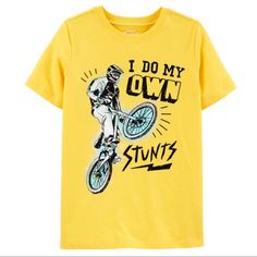 Oshkosh Boys Bicycle Bike Bmx Stunts Tee Shirt Short Sleeve Yellow Tee Shirt Featuring Bike Rider Popping A Wheelie On His Bicycle In White, Black, And Blue “I Do My Own Stunts” Lettering In Black New With Tags Oshkosh B’gosh Sizes Available: 10, 12, 14 Colors: Yellow, Black, Blue, White 100% Cotton New To Poshmark? Use Code Rvalm When You Sign Up And Get $10 Off Your First Order! I Do My Own Stunts, Bike Print, Bike Rider, Animal Cartoon, Boy Tees, Shirt Short Sleeve, Bicycle Bike, Boys Shirts, Boys T Shirts