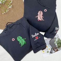 Show off your dino-mite connection with our matching embroidered dinosaur hoodies. These personalized sweatshirts for couples are perfect for sharing a fun, unique style, making them an ideal gift for your girlfriend or boyfriend to celebrate your relationship. 💞 Product and Brand Details   ABOUT STYLE SHIRT - T-shirt is short sleeve - Crewneck same sweatshirt is not hood - Hoodie with hood ➤ Gildan ® brand ➤ Unisex & Classic fit ➤ 8 oz./yd² (US) 13.3 oz./L yd (CA), 50/50 cotton/polyester, 20 singles - Heather Sport colors are 60/40 polyester/cotton - Safety Green is compliant with ANSI / ISEA 107 high-visibility standards - 1x1 rib with spandex for enhanced stretch and recovery - Tear away label - Proud member of the U.S. Cotton Trust Protocol 💞 Store Information   ➤ Design proof (for c Casual Cotton Sweatshirt With Dinosaur Print, Dinosaur Hoodies, Sweatshirts For Couples, Embroidered Dinosaur, Personalized Sweatshirts, Dinosaur Hoodie, Matching Hoodies For Couples, Matching Hoodies, Gifts For Your Girlfriend