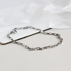 Dainty bracelet made from delicate surgical steel chain. MATERIAL Stainless steel/surgical steel ▪ does not cause allergic reactions, ▪ does not tarnish, stain or fade ▪ does not rust or corrode, ▪ does not change color, ▪ does not turn your skin green, ▪ it requires little to no maintenance, ▪ it is much more durable than silver or platinum, It will stay shiny and beautiful for a very long time. PACKAGING All my products are packed in an eco-friendly, recyclable gift box or nicely wrapped in a Minimalist Anklet, Dainty Anklet, Surgical Steel Earrings, Star Chain, Dainty Bracelet, Minimalist Bracelet, Eye Earrings, Dainty Bracelets, Chain Anklet