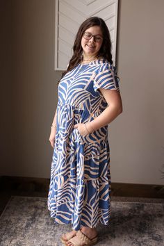 This Blue Boho Tiered Maxi Dress is perfect for a happy and simple summer look. The light weight material will keep you comfortable while the flowy tiered design adds a touch of feminine chic. Plus, it has pockets for added convenience! The Fit of This Boutique Maxi Dress: See HOW TO MEASURE Here. TOP: Flat Across Measurements in Inches Size: Chest Across Waist Across Length Small 17 25 45 Medium 18 26 45 Large 19 27 46 X-Large 21 29 47 2XL Casual Tiered Ruffle Dress, Casual Tiered Sundress, Casual Tiered Skirt Maxi Dress, Casual Tiered Midi Dress For Day Out, Spring Tiered Dress With Pockets, Blue Beach Midi Dress With Pockets, Casual Tiered Maxi Dress For Day Out, Blue Midi Beach Dress With Pockets, Flowy Tiered Casual Midi Dress