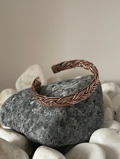 "Discover our beautiful and unique Handmade Pure Copper Bracelet from Nepal 🌍✨Crafted with love by skilled Nepali artisans whom we work closely with to bring our vision to life, these timeless accessories are simple yet exquisite. Add a touch of charm to your wrist with this special copper bracelet, carefully crafted by talented artisans in Kathmandu Nepal. The beautiful detailing and warm copper tones make it a timeless accessory that goes with any outfit. Wear a piece of Nepal's craftsmanship and culture - a simple yet stylish statement for any occasion. 🧡🌟\" #1 - Size: 18cm Width - 10mm Weight - 25 gms  Benefits of Wearing Copper Bracelets: Copper bracelets are believed to offer various potential benefits, including anti-inflammatory properties, improved circulation, and potential re Handmade Spiritual Braided Bangle Bracelet, Handmade Adjustable Artisan Bangle, Artisan Adjustable Bangle Bracelets, Bronze Hand Wrapped Cuff Bracelet For Gift, Bronze Hand Wrapped Cuff Bracelet Gift, Unique Braided Bangle Bracelets As Gifts, Unique Braided Bangle Bracelets For Gifts, Handmade Copper Spiritual Bangle, Artisan Bangle Bracelets For Friendship