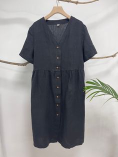 "This linen midi dress is a perfect example of beauty in simplicity. Made from breathable and soft linen, just right below the knee length, back tie at the neck line, this classic piece is such a no-brainer go to item. - Handmade with 100% medium weight linen - Short sleeves - Scoop neck - Button down front - Below the knee length or customized length per request Please provide your shoulder width, full bust measurement ( measured around the fullest part ) and your height in the note to seller b Short Sleeve Maxi Dress With Buttons For Summer, Short Sleeve Maxi Dress With Button Closure, Summer Maxi Dress With Short Sleeves And Buttons, Summer Maxi Dress With Buttons And Short Sleeves, Short Sleeve Summer Dresses With Buttons, Short Sleeve Vacation Dress With Button Closure, Short Sleeve Beach Dress With Button Closure, Summer Dresses With Buttons And Short Sleeves, Short Sleeve Dresses With Button Closure For Vacation