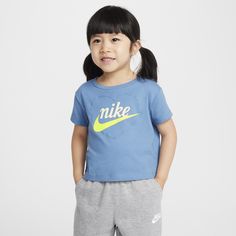 Your little one can make an impression at the playground, on the field or with classmates in this tee, which easily complements their Nikes. It's made of soft cotton/poly jersey knit fabric in a boxy cut that creates a modern, cropped look with a tagless crewneck for a comfy feel. Screen Print Short Sleeve T-shirt For Playtime, Casual Blue T-shirt With Heart Graphic, Soft-washed Cotton Tops For Playwear, Spring Sports T-shirt Pre-shrunk, Nike Sports Tops With Screen Print, Sporty T-shirt For Summer Playtime, Casual Letter Print T-shirt For Playtime, Basic Cotton T-shirt For Playwear, Basic Short Sleeve T-shirt For Play