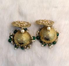 Dark Gold jhumka earrings tikka set. Earrings length: 2.8 inches (with drops) Stud diameter- 1.2 inches Dome Size: 1.1 inches Green Jhumkas For Wedding And Eid, Traditional Green Jhumkas For Wedding, Green Jhumkas With Stone Work, Traditional Green Jhumkas For Eid, Green Zari Work Earrings For Wedding, Traditional Green Jhumkas For Festive Occasions, Green Traditional Jhumkas For Diwali, Festive Green Traditional Jhumkas, Festive Green Round Jhumkas